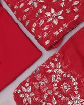 Red fabric with white floral patterns on a white background